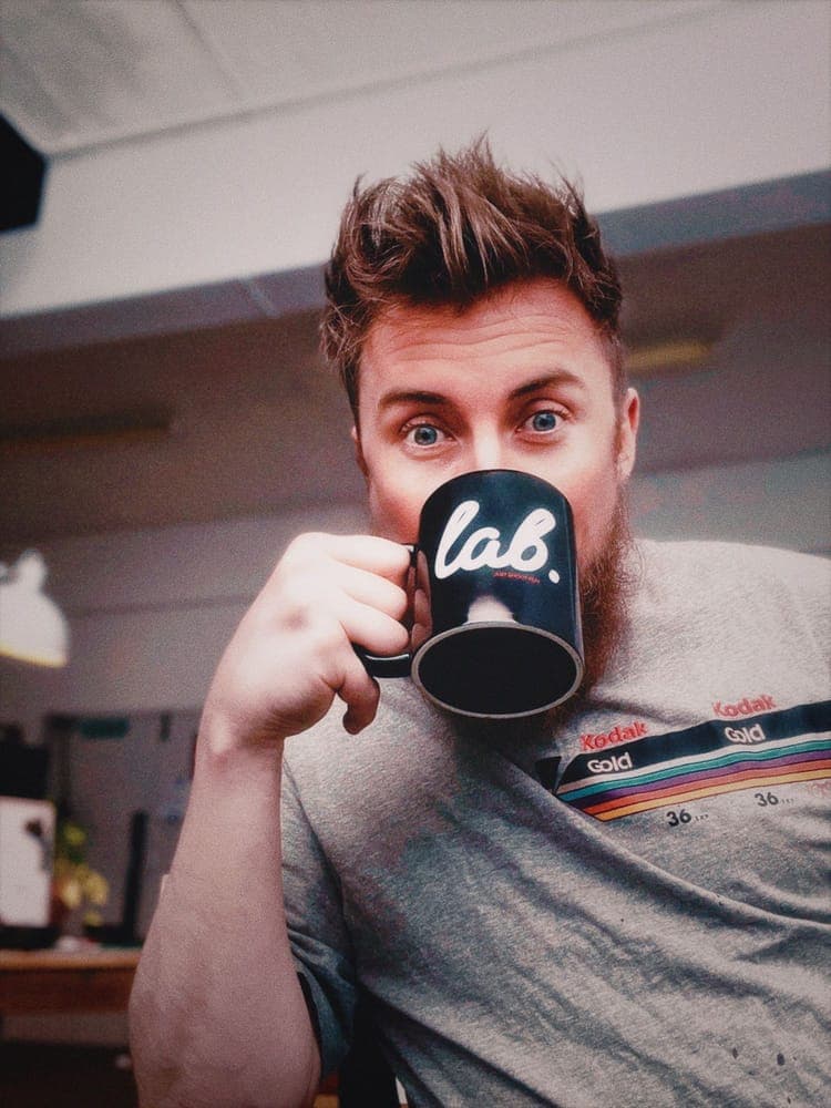 David, who runs Just Shoot Film, drinking from a lab. mug