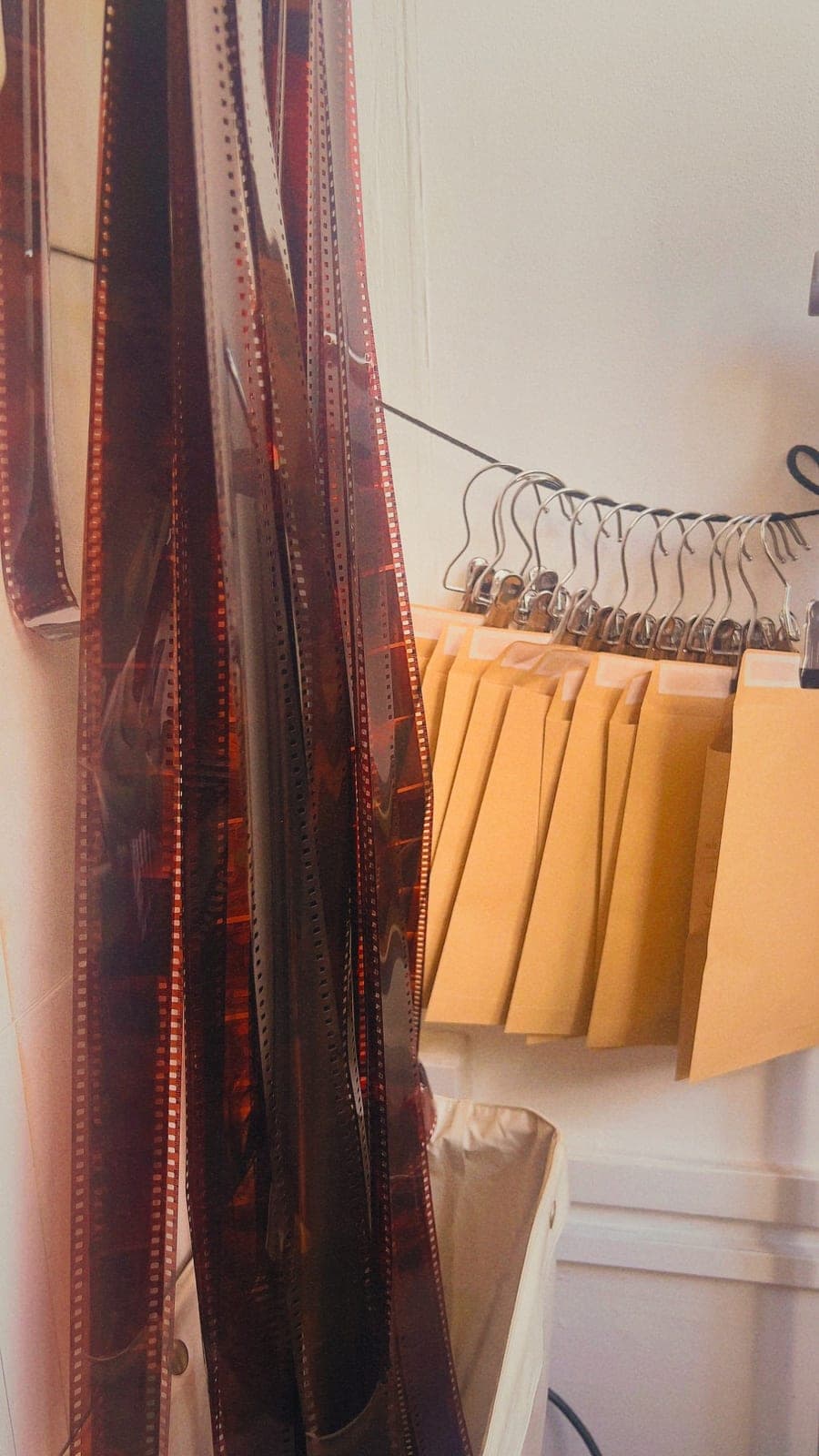 Freshly developed negatives hanging up to dry in the lab